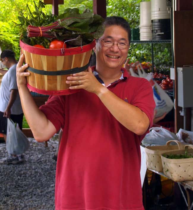 man with vegetable basket, Pendergrast Farm Conservation Community